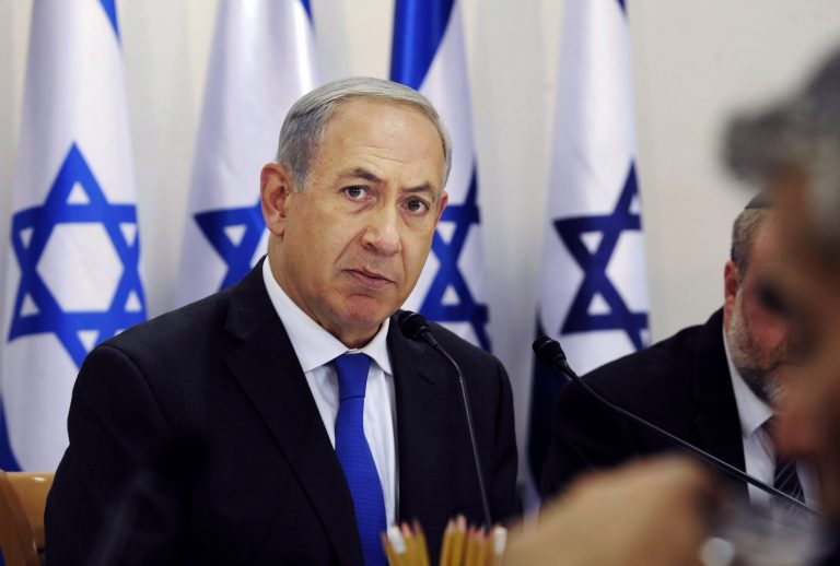 Israeli Prime Minister Benjamin Netanyahu attends the weekly cabinet meeting in Sde Boker, Israel, Sunday, Nov. 10, 2013. Netanyahu said that Israel would do all it could to keep world powers from striking a 