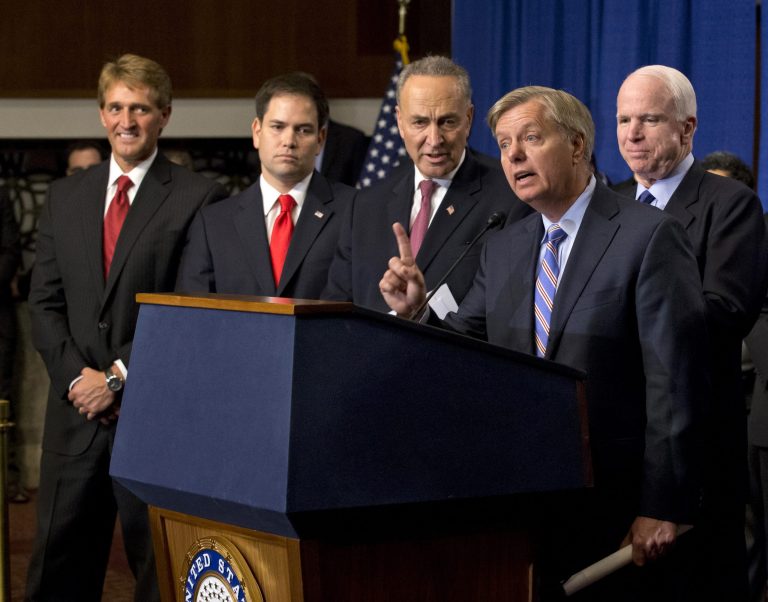 The Senate voted down a Republican attempt to require the U.S.-Mexico border to be under control for six months before immigrants here illegally could take the first steps toward citizenship. From left are, Sen. Jeff Flake, R-Ariz., Sen. Marco Rubio, R-Fla., Sen. Charles Schumer, Graham, and Sen. John McCain, R-Ariz. (AP Photo/J. Scott Applewhite, File)