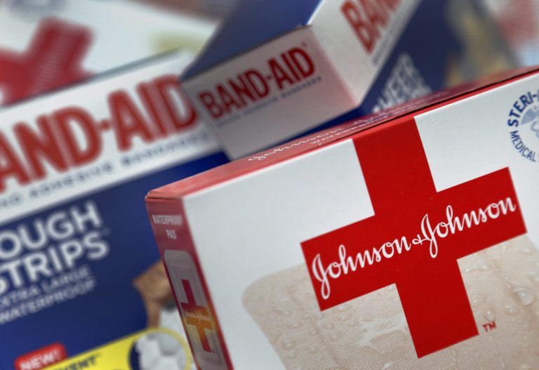 This Oct. 16 2012 photo shows Johnson and Johnson products, including Band Aid brand adhesive bandages, arranged for a photo in St. Petersburg, Fla. Johnson & Johnson reports quarterly financial results before the market opens on Tuesday, April 15, 2014. (AP Photo/Chris O'Meara)