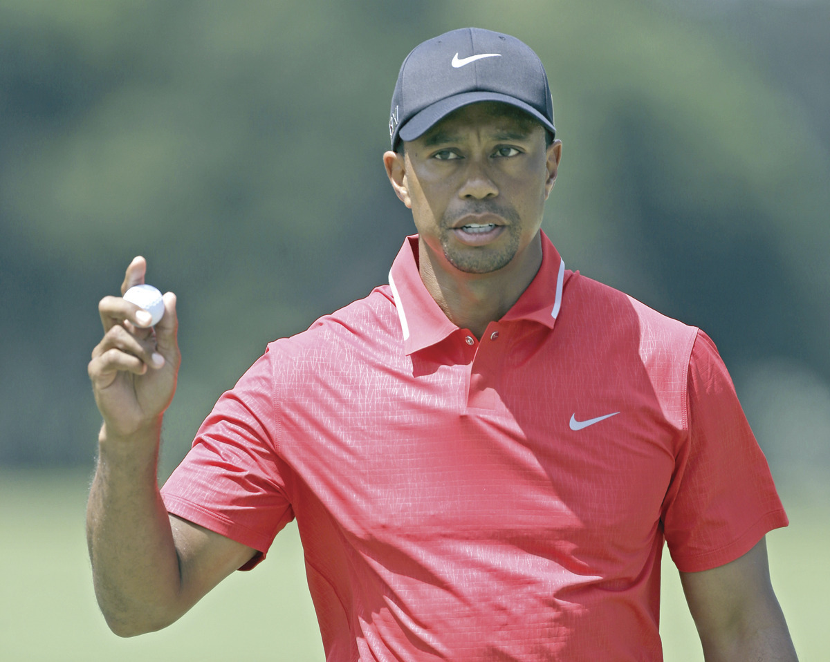 Tiger Woods keeps it dry and wins Players Championship