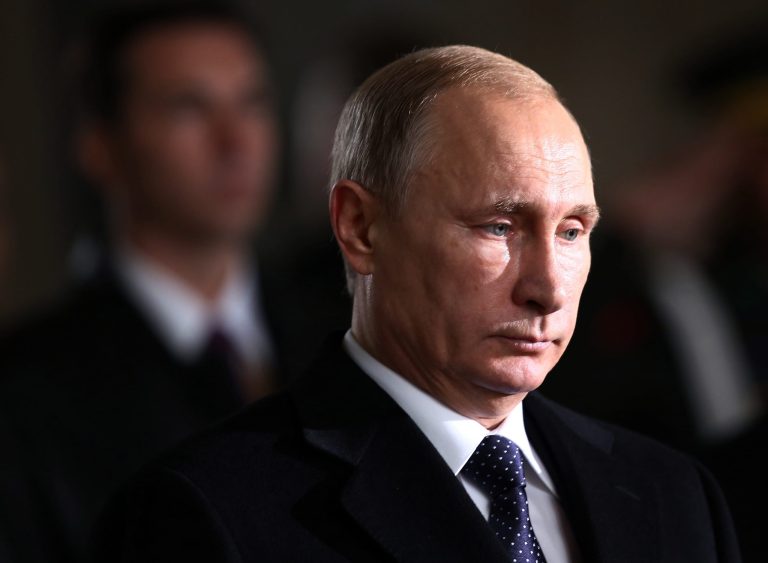 Russian President Vladimir Putin stands for a minute of silence at the mausoleum of modern Turkey's founder Mustafa Kemal Ataturk in Ankara, Turkey, Monday, Dec. 1, 2014. (AP Photo)