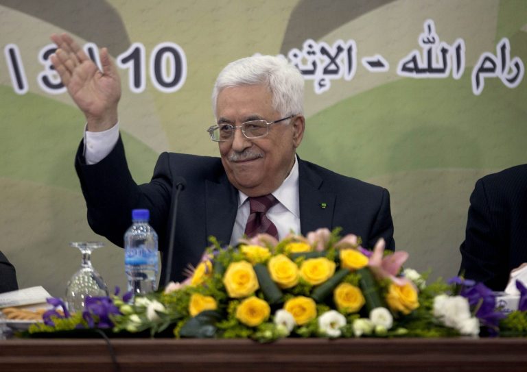 In this March 10, 2014 file photo, Palestinian President Mahmoud Abbas gestures during a meeting of the Fatah revolutionary council in the West Bank city of Ramallah. A long-running personal feud between Palestinian President Mahmoud Abbas and a former powerful operative in his Fatah movement has erupted into the open with public accusations of deceit and corruption. Abbas' hour-long tirade against the exiled Mohammed Dahlan signals the battle is heating up over who will one day succeed the 79-year-old president. (AP Photo/Majdi Mohammed, File)