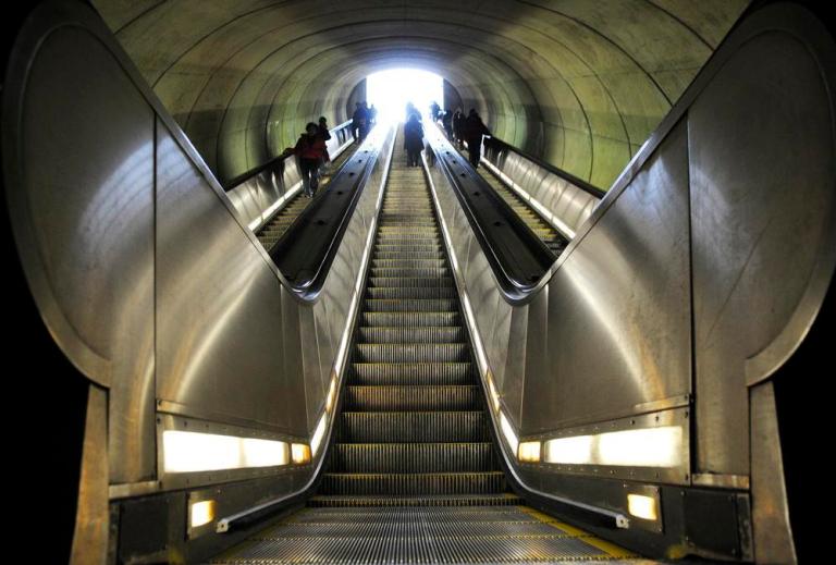 Metro riders enter and exit at the Dupont Circle Metro station in this file photo. 