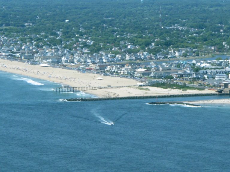 This July 11, 2014 aerial photo shows the Shark River Inlet in Belmar, N.J. as seen from an airplane operated by the New Jersey Department of Environmental Protection. Since the federal Environmental Protection Agency ended its flights along the coast this year, the New Jersey DEP is the only agency that does aerial pollution checks along the Jersey shore. (AP Photo/Wayne Parry)