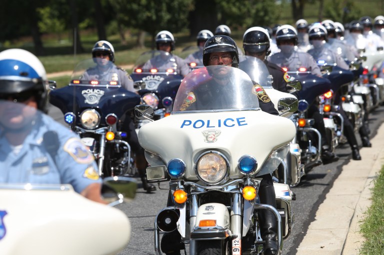 Police officers on motorcycles at the funeral of  Officer First Class Adrian Morris. (Graeme Jennings/Examiner)