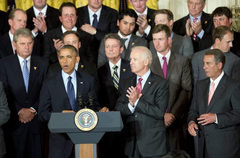 President Barack Obama, front left to right, with Vice President Joe Biden and House Speaker John Boehner, R-Ohio, speaks honoring members of the 2013 Presidents Cup team during a ceremony in the East Room of the White House, Tuesday, June 24, 2014 in Washington. The U.S. team beat an international squad during the Presidents Cup matches in October 2013.  (AP Photo/Manuel Balce Ceneta)