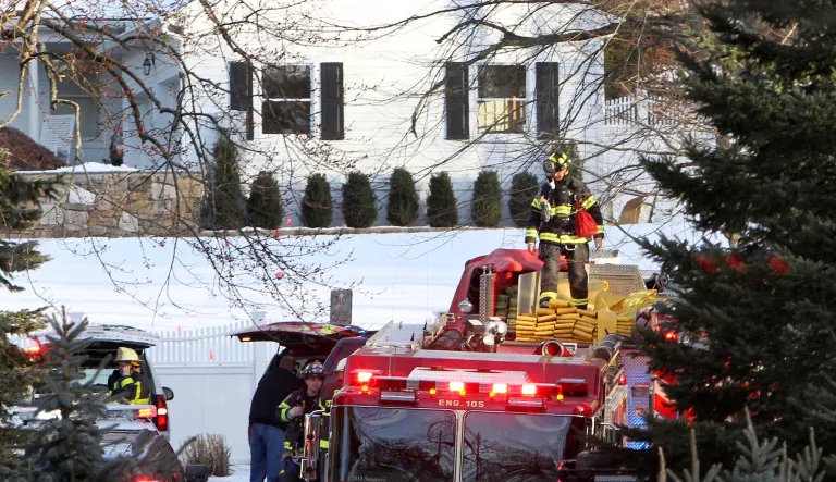 Firefighters extinguished a small fire at the home of former President Bill Clinton and his wife Hillary Clinton on Wednesday in Chappaqua, N.Y. (Frank Becerra Jr./ The Journal News via AP)