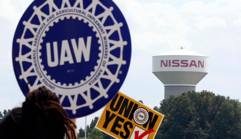 The UAW refuses to accept that the object of their desire wants no relationship with them. (AP Photo/Rogelio V. Solis)