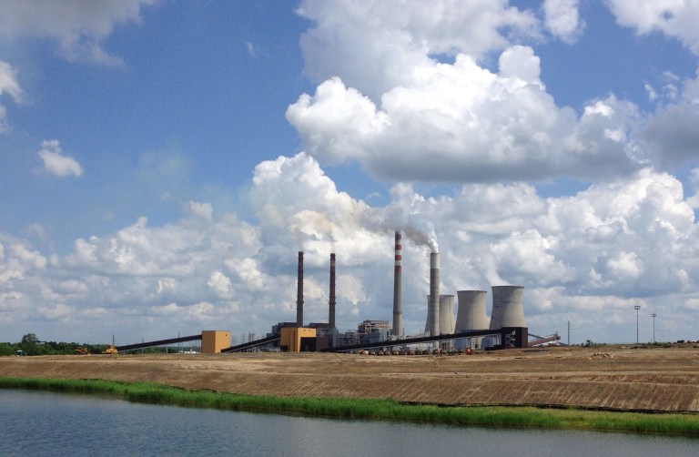 FILE - In a June 3, 2014, photo, the Paradise Fossil Plant stands in Drakesboro Ky. A group of landowners and a Kentucky coal industry group are asking a federal judge to halt plans to shut down two coal-fired units at the Tennessee Valley Authority power plant in western Kentucky. The Kentucky Coal Association argues in the suit filed Thursday, July 10, 2014, that the TVA did not follow proper federal procedure and its own rules in deciding to close the units at the Paradise Fossil Plant. (AP Photo/Dylan Lovan, File)
