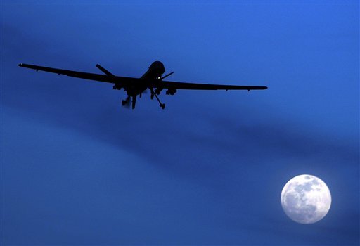 FILE - In this Jan. 31, 2010 file photo, an unmanned U.S. Predator drone flies over Kandahar Air Field, southern Afghanistan, on a moon-lit night. A U.N. expert on Thursday, Jan. 24, 2013 launched a special investigation into drone warfare and targeted killings, which the United States relies on as a front-line weapon in its global war against al-Qaida. The civilian killings and injuries that result from drone strikes on suspected terrorist cells will be part of the focus of the probe by British lawyer Ben Emmerson, the U.N. rapporteur on Counter-Terrorism and Human Rights. His office announced the investigation in London.  (AP Photo/Kirsty Wigglesworth, File)