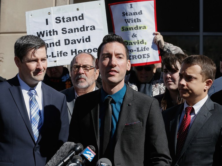 In January, a Houston grand jury declined to indict the nation's largest provider of abortions over the CMP videos, and instead went after David Daleiden, center, and Sandra Merritt for the techniques they used to bring the fetal organ scandal to light. (AP Photo/Bob Levey)