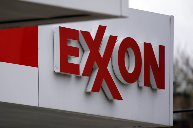 This April 29, 2014 photo shows an Exxon sign at a Exxon gas station in Carnegie, Pa. Exxon Mobil Corp. reports quarterly financial results before the market opens on Thursday, July 31, 2014. (AP Photo/Gene J. Puskar)