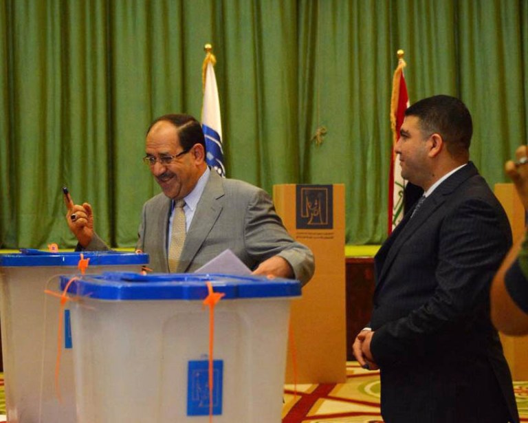 Iraqi Prime Minister Nouri al-Maliki shows his ink-stained finger after casting his vote inside the heavily fortified Green Zone in Baghdad, Iraq, Wednesday, April 30, 2014. Iraqis braved the threat of bombs and other violence to vote Wednesday in parliamentary elections amid a massive security operation as the country slides deeper into sectarian strife. (AP Photo)