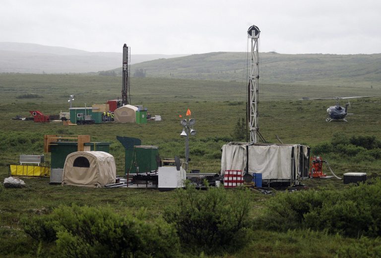 FILE - In this July 13, 2007 file photo, workers with the Pebble Mine project test drill in the Bristol Bay region of Alaska near the village of Iliamma. The U.S. Environmental Protection Agency is proposing restrictions that would essentially block development of a massive gold-and-copper prospect near the headwaters of a world-premier salmon fishery in Alaska. The Friday July 18, 2014 announcement comes as the EPA is being sued by the group behind the proposed Pebble Mine, the Pebble Limited Partnership, and the state of Alaska for exceeding its authority. (AP Photo/Al Grillo, File)
