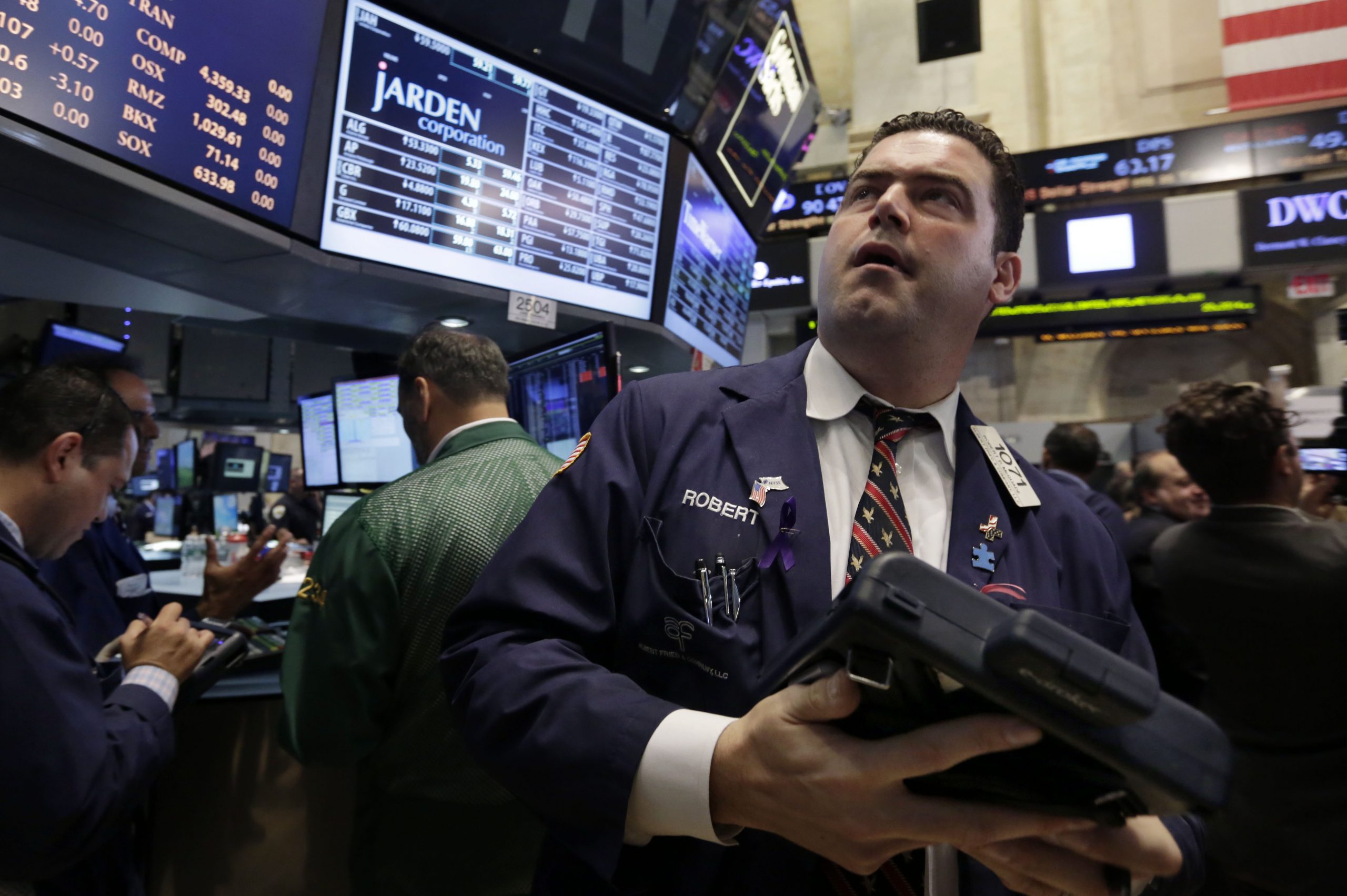 Stocks manage small gains; Dow, S&P 500 at records