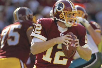Pablo Martinez Monsivais/AP
John Beck replaced Rex Grossman in the second half Sunday and completed eight of 15 passes for 117 yards and ran for a score.