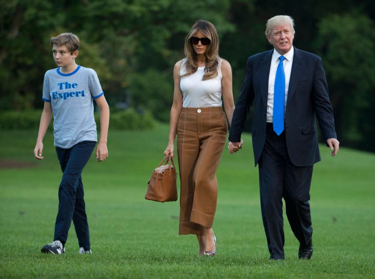 President Donald Trump, first lady Melania Trump, and their son and Barron Trump walk from Marine One across the South Lawn to the White House in Washington, Sunday, June 11, 2017, as they return from Bedminster, N.J. (AP Photo/Carolyn Kaster)
