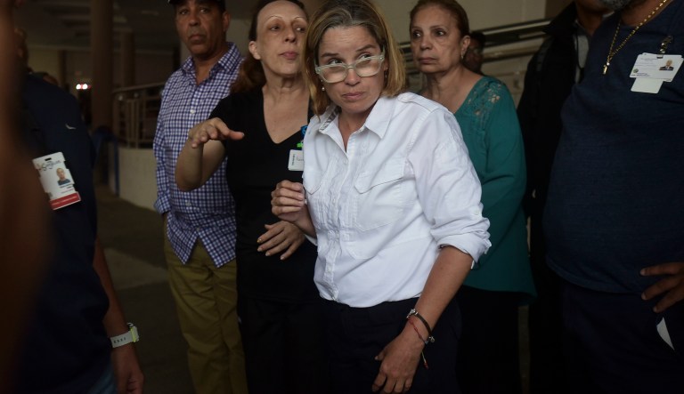 Mayor Carmen Yulin Cruz arrives at San Francisco hospital in Rio Piedras area of San Juan, Puerto Rico. Cruz is open to meeting with President Trump when he visits the U.S. territory on Tuesday. (AP Photo/Carlos Giusti)