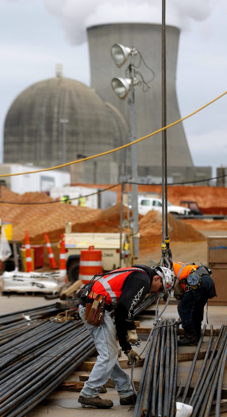   In this photo taken Monday, Dec. 11, 2012 an man works on a new nuclear reactor at the Plant Vogtle nuclear power plant in Augusta, Ga., Atlanta-based Southern Co. planned to have the first of its new reactors at the plant built by April 1, 2016. A second reactor in eastern Georgia was supposed to come online the following year but it could take at least a year longer than expected and involve hundreds of millions of dollars in extra costs. (AP Photo/John Bazemore)  