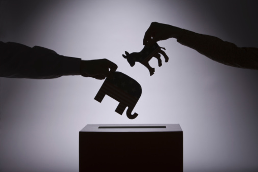 People putting political symbols in box