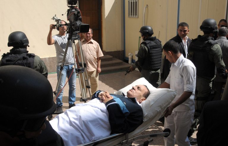   FILE - In this Wednesday, Sept. 7, 2011 file photo, former Egyptian president Hosni Mubarak lies on his bed while being taken to the courtroom for another session of his trial in Cairo, Egypt. Doctors used a defibrillator twice on Hosni Mubarak when they could not find a pulse Monday, the latest health crisis for the ousted Egyptian president since he was sentenced to life and moved to a prison hospital nine days ago, security officials said. (AP Photo/Mohammed al-Law, File)  