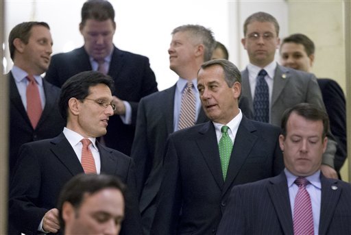 Speaker of the House John Boehner, R-Ohio, center right, and House Majority Leader Eric Cantor, R-Va., center left, walk down stairs to a second Republican conference meeting to discuss the 