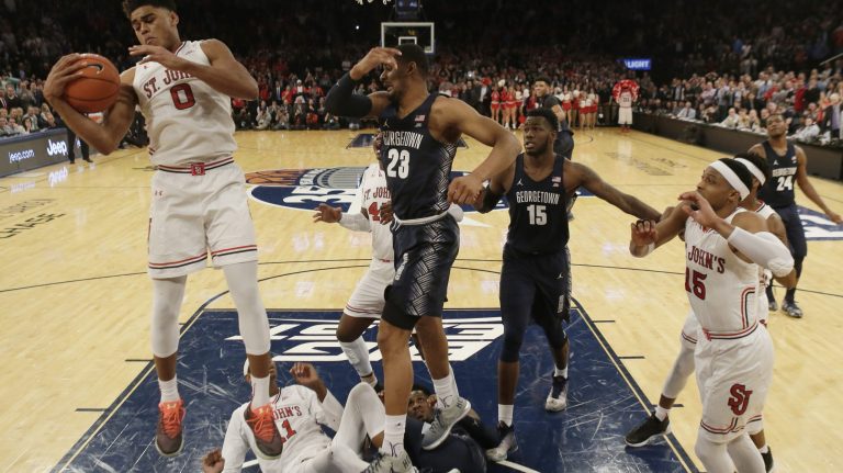 It's time to end the corruption and scandals. Let schools pay athletes. Free athletes to earn what their services are worth. St. John's Malik Ellison (0) rebounds the ball to end the game during the second half of an NCAA college basketball game against the Georgetown during the Big East men's tournament March 8 in New York. AP Photo/Frank Franklin II)
