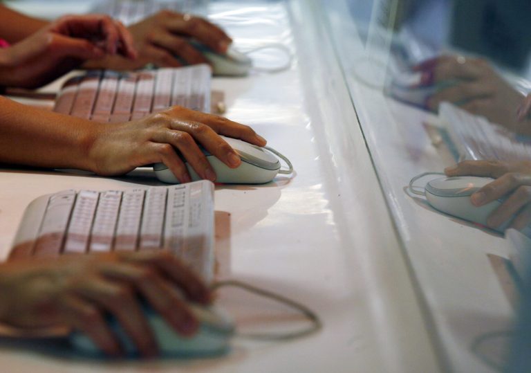 FILE - In this June 16, 2013 file photo, Internet users browse the Internet in Hong Kong. Recent hacks exposing nude photographs of Jennifer Lawrence and other celebrities are prompting calls for people to fortify their online accounts with a second layer of security. (AP Photo/Kin Cheung, File)