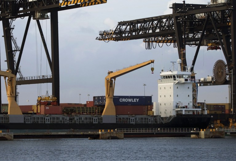 The U.S. trade deficit widened only slightly in August, dragged lower by a modest decline in exports. (AP/J Pat Carter)