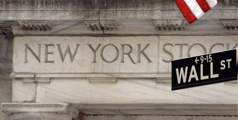 FILE - In this May 11, 2007 file photo, a Wall Street sign is seen at an entrance to the New York Stock Exchange. Global stock markets were mostly lower Thursday May 15, 2014 ahead of quarterly European growth figures that investors hope will show a strengthening economic recovery.  (AP Photo/Richard Drew, file)