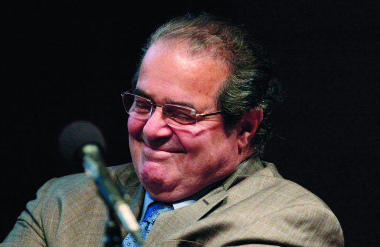 FILE - In this Oct. 18, 2011, file photo U.S. Supreme Court justice Antonin Scalia smiles during a college address in Chicago. Scalia said late Wednesday July 18, 2012, that he hasn't had a 