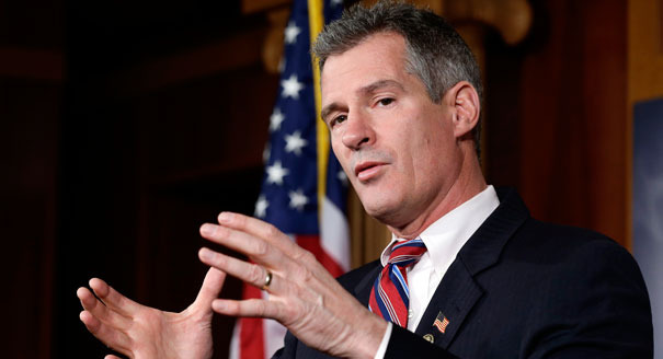 Sen. Scott Brown, R-Mass., speaks during a media availability, on Capitol Hill Tuesday, Nov. 13, 2012, in Washington. (AP Photo/Alex Brandon)