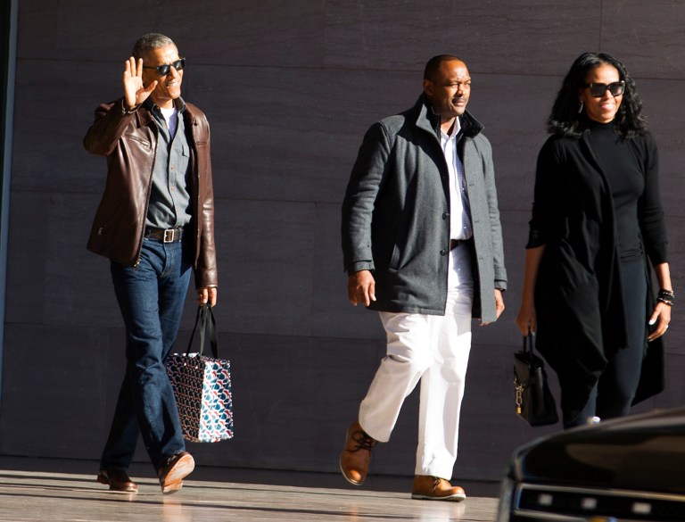 Former President Barack Obama, accompanied by former first lady Michelle Obama, waves as they leave the National Gallery of Art in Washington, Sunday, March 5, 2017. ( AP Photo/Jose Luis Magana)