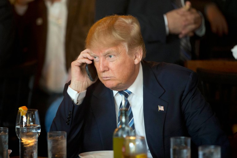 Experts say if Trump carries a personal smartphone around with him, it could be easily hacked. (AP Photo/Matt Rourke, File)