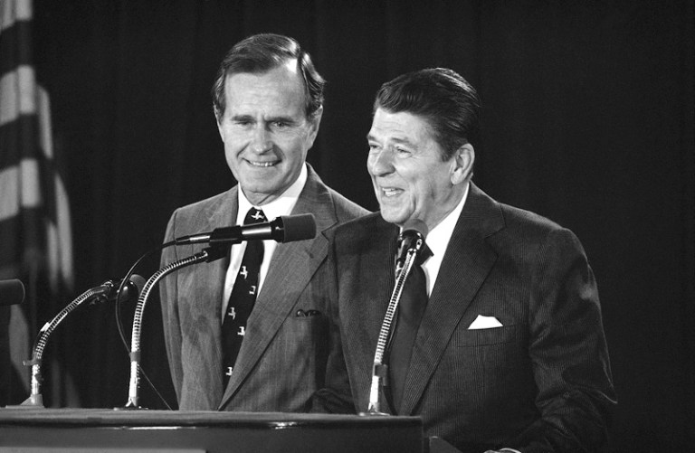 Republican presidential candidate Ronald Reagan and his choice for Vice President George Bush field questions from reporters during a news conference in Detroit, Thursday, July 17, 1980. (AP Photo)