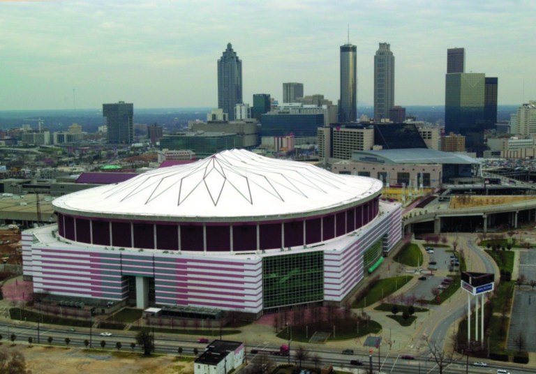 FILE - This Feb. 28, 2001 file photo shows an aerial view of the Georgia Dome in Atlanta. Authorities say a 20-year-old man who plunged about 35 feet from the Georgia Dome's upper level and struck another fan during the Tennessee-North Carolina State college football game has died. The man fell on another football fan seated in the mezzanine area Friday, Aug. 31, 2012. The Georgia World Congress Center Authority, which operates the downtown football stadium, said in a statement. (AP Photo/Atlanta Journal-Constitution, Rich Addicks)