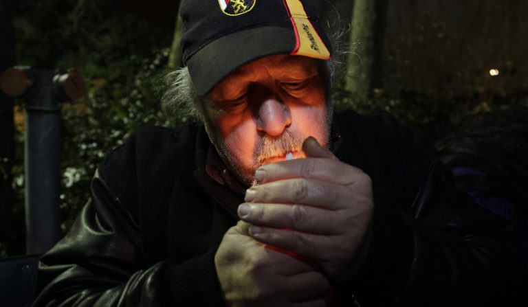   Mike Momany smokes marijuana, Thursday, Dec. 6, 2012, just after midnight at the Space Needle in Seattle. Possession of marijuana became legal in Washington state at midnight, and several hundred people gathered at the Space Needle to smoke and celebrate the occasion, even though the new law does prohibit public use of marijuana. (AP Photo/Ted S. Warren)  
