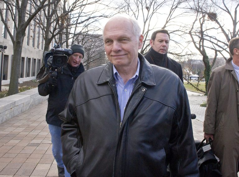 Former United States Environmental Protection Agency executive John Beale, who pretended to work for the CIA to avoid the office, departs U. S. District Court in Washington, D.C. on Wednesday, December 18, 2013. (Ron Sachs / CNP)