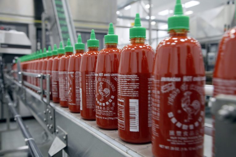 FILE - In this  Tuesday, Oct 29, 2013, file photo, Sriracha chili sauce is produced at the Huy Fong Foods factory in Irwindale, Calif. The Commerce Department reports on wholesale prices for October on Thursday, Nov. 21, 2013. (AP Photo/Nick Ut, File)