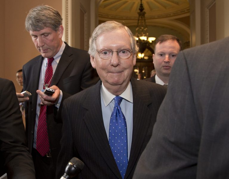 Senate Minority Leader Sen. Mitch McConnell, R-Ky., is followed by reporters after agreeing to the framework of a deal to avoid default and reopen the government on Capitol Hill on Wednesday, Oct. 16, 2013 in Washington. The partial government shutdown is in its third week and less than two days before the Treasury Department says it will be unable to borrow and will rely on a cash cushion to pay the country's bills. (AP Photo/Carolyn Kaster)