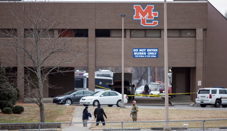 Authorities investigate the scene after a deadly shooting at Marshall County High School in Benton, Ky. (Ryan Hermens/The Paducah Sun via AP)