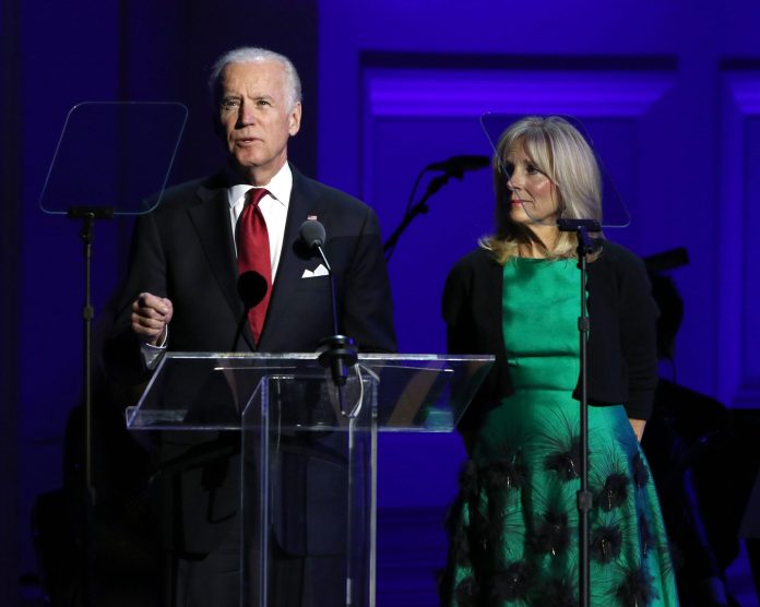 Vice President Joe Biden, left, with wife Jill Biden, said "We have the capacity to change the desperate circumstances endured by millions of people around the world and to change those circumstances in real time -- not down the road, not a long time from now." (Photo by Greg Allen/Invision/AP)