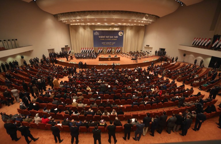 FILE - In this Monday, Sept. 8, 2014 file photo, Iraqi lawmakers attend a session to approve the new government in Baghdad, Iraq. Iraq's parliament rejected defense and interior nominees on Tuesday, Sept. 16, 2014, leaving the crucial ministerial posts unfilled as a U.S.-led coalition intensifies its air campaign against Islamic extremists who have seized a third of the country. The two powerful security portfolios have long been a source of tension among Iraq's feuding political factions, and the failure to agree on the nominees marked the latest in a series of delays in forming a unified government that can confront the Islamic State extremist group. (AP Photo/Karim Kadim, File)