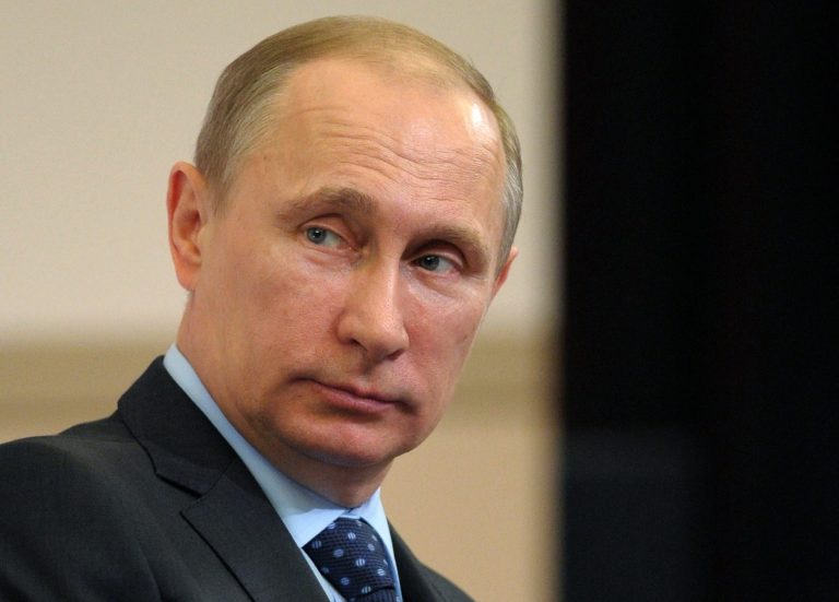 Russian President Vladimir Putin attends a meeting of a board of trustees of the Russian Geographical Society in a library of Moscow State University in Moscow, Russia, Tuesday, April 15, 2014.