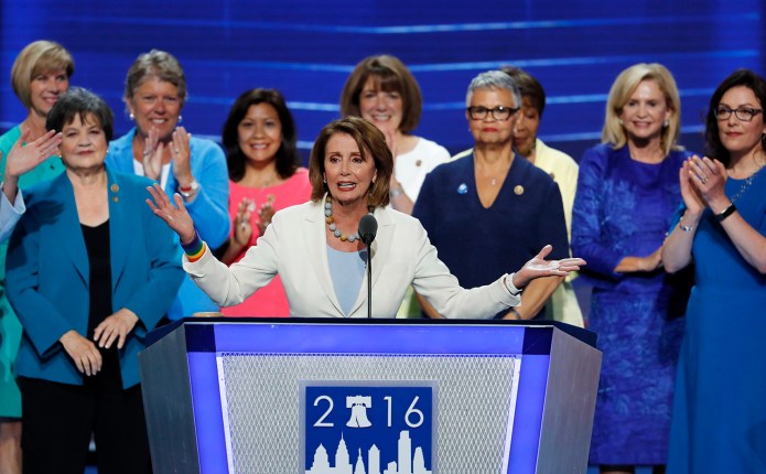 "The Democratic women of the House are leading the way to unleash the power of America's women and working families in our economy, in our society and in our democracy," said House Minority Leader Nancy Pelosi, flanked on both sides by Democratic congresswomen. (AP Photo/J. Scott Applewhite)