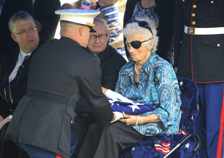   A Marine honor guard presents 82-year-old Josephine 