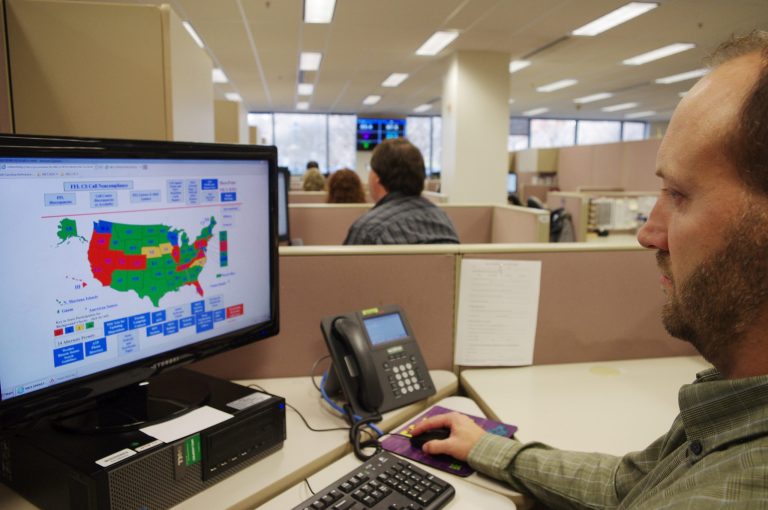 A researcher simulates a check done for the National Instant Criminal Background Check System or NICS, at the FBI's criminal justice center in Bridgeport, W.Va. (AP Photo/Matt Stroud)