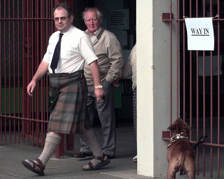 FILE - This is a Thursday Sept. 11, 1997 file photo of a Scottish voter Rory Murray as he leaves the polling station in Bo'ness, 24 kms , 15 miles northeast of Edinburgh after casting his vote in the Scottish referendum Thursday Sept. 11, 1997. Scots voted  on creating their own Parliament, the biggest wrench from England in 290 years of union. On Thursday Sept. 18, 2014: Scottish voters decide whether to keep Great Britain intact or end their union with England, Wales and Northern Ireland. (AP Photo/Max Nash, File)