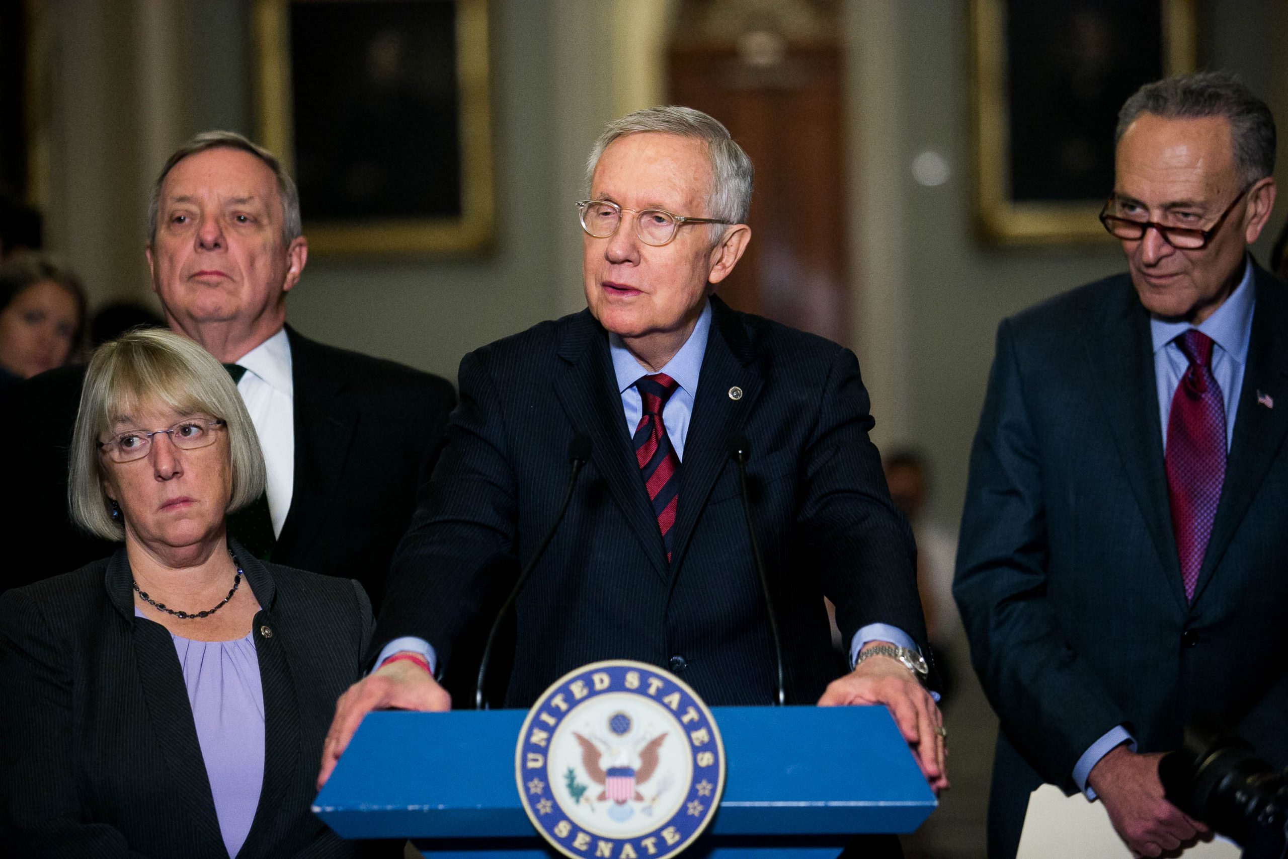 Reid to support spending, tax deal