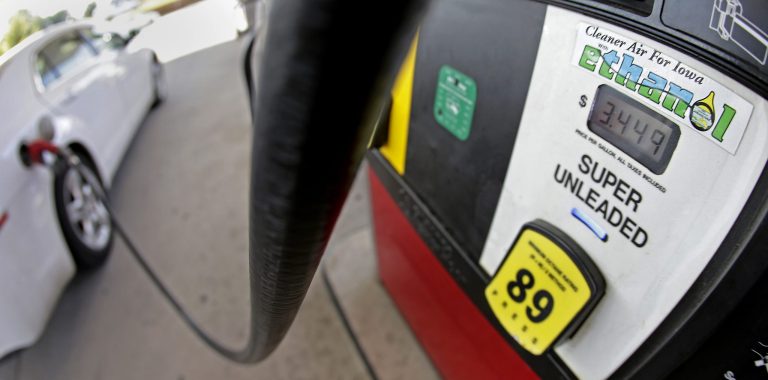FILE This July 26, 2013 file photo shows a motorist filling up with gasoline containing ethanol in Des Moines. The Obama administration on Friday proposed to reduce the amount of ethanol in the nation's fuel supply for the first time, acknowledging that the biofuel law championed by both parties in 2007 is not working as well as expected.